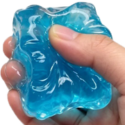 Blue Epic Squish Moon Cube squeezed in hand