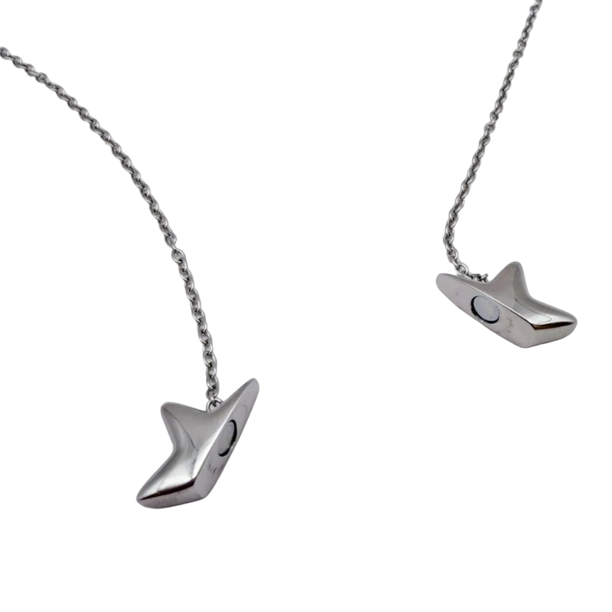 A silver-toned star shaped fidget necklace with a unique, stylized pendant shaped like a stylized bird or fish head, displayed on a clean white background.