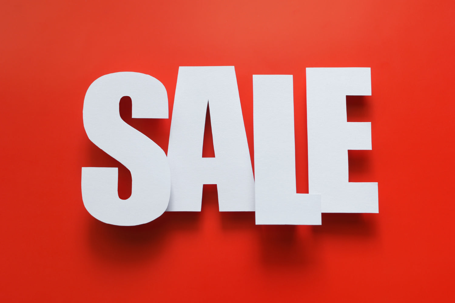 White 'SALE' text on a red background