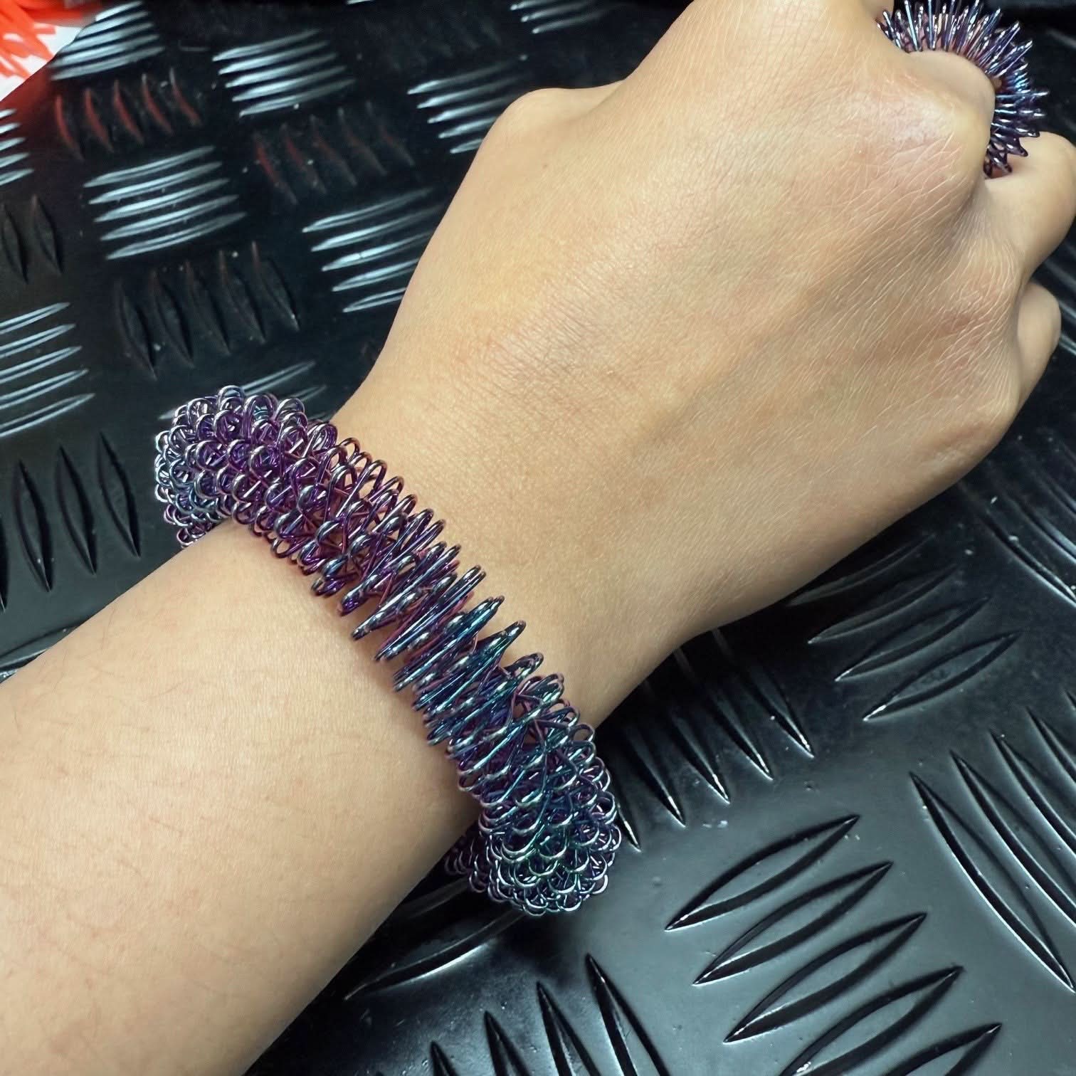 OIL SLICK Wrist Spikey - Harm Minimisation & Regulation Tool