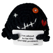 Front-facing I'm About to Be the Entire Problem black crochet critter with message