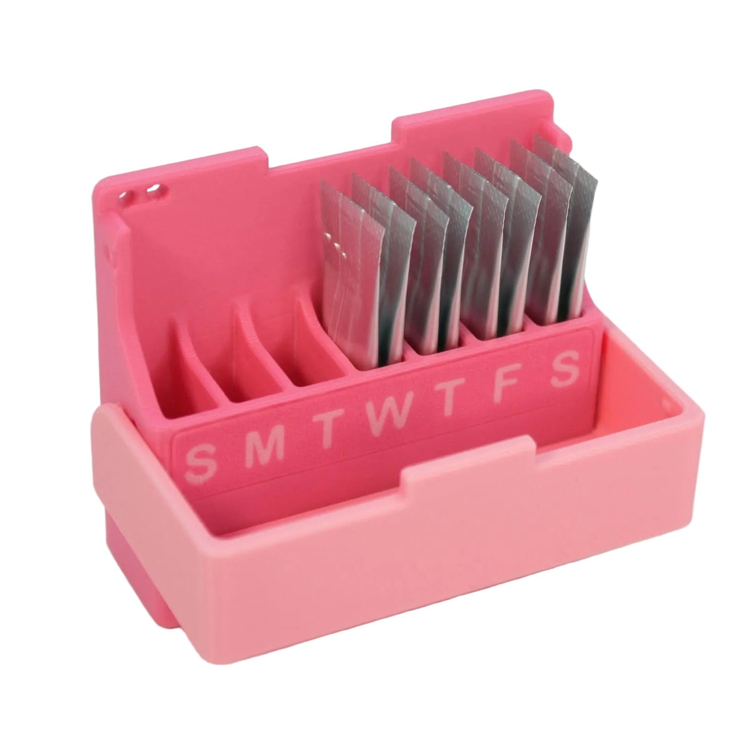 Open EstroBox showing weekly gel sachet storage