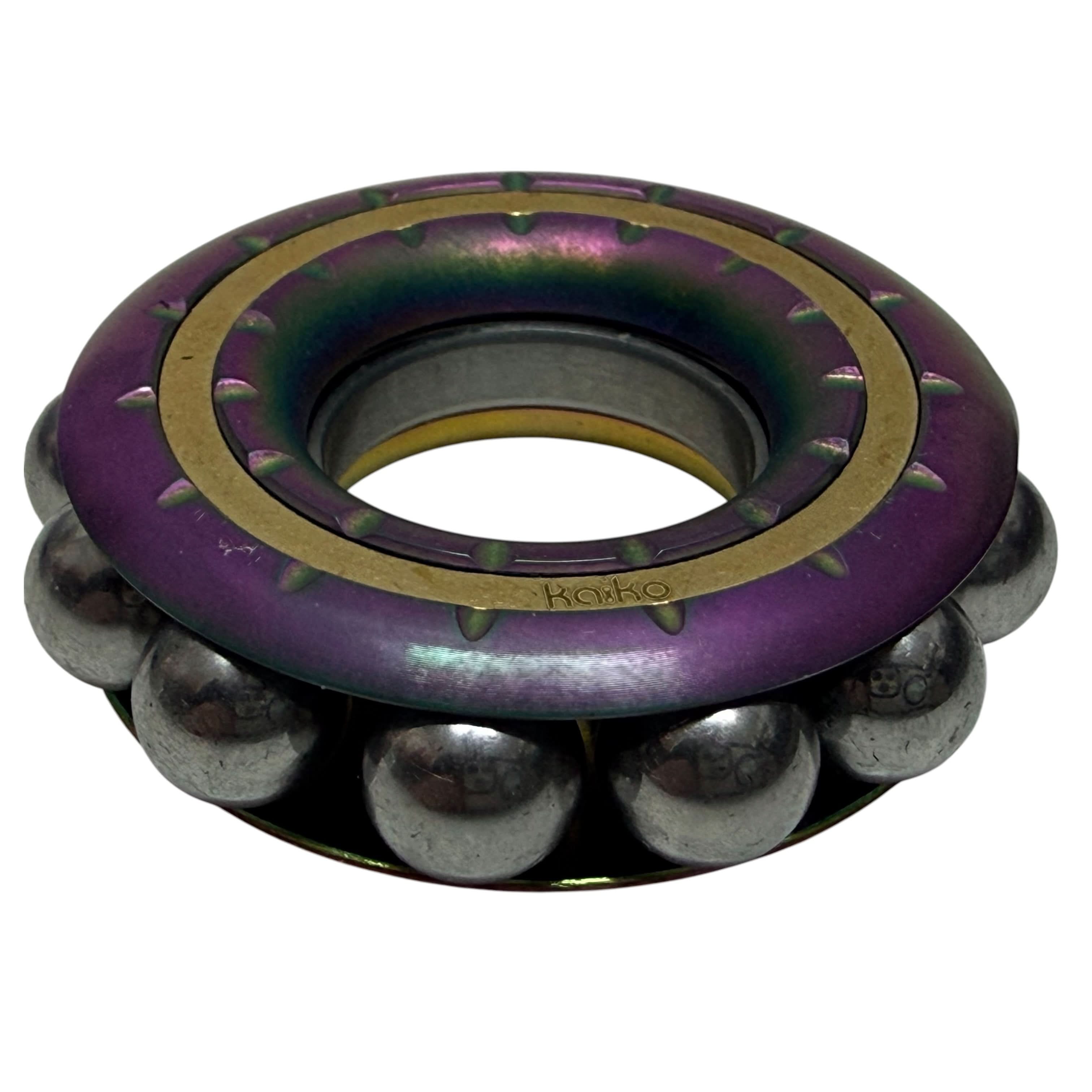 Freewheel Spinner in oil slick finish showing stainless steel balls
