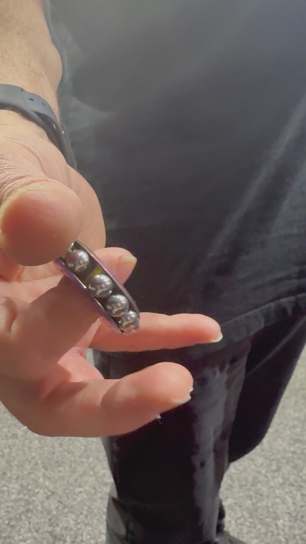 Load video: Freewheel Spinner – Oil Slick Metal Sensory Tool