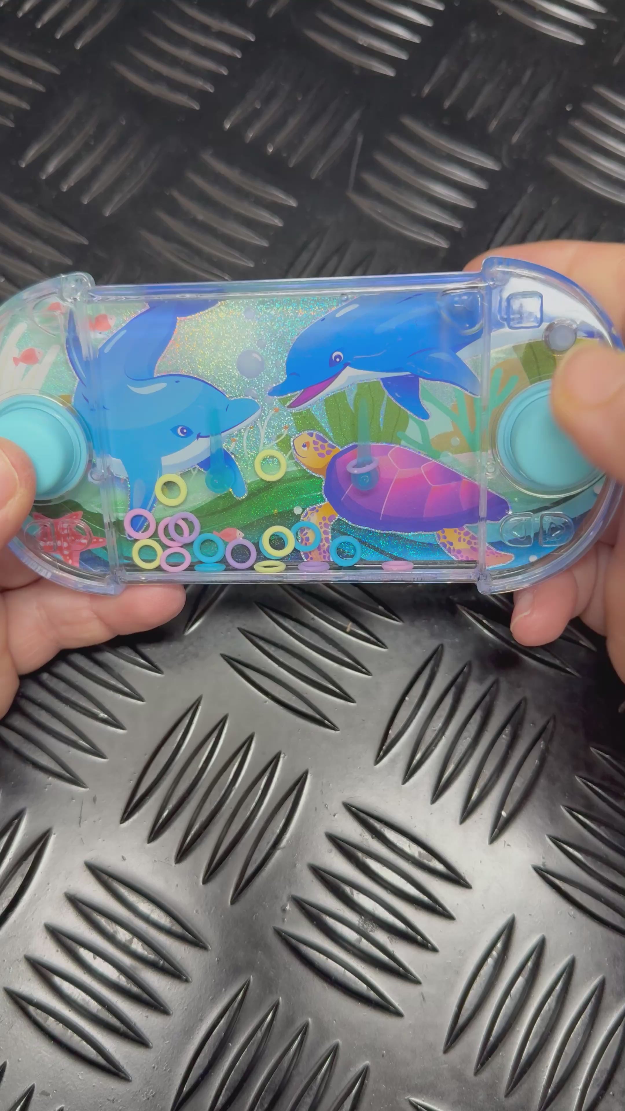 Load video: Retro Water &amp; Ring Hand Held Sea Themed Game
