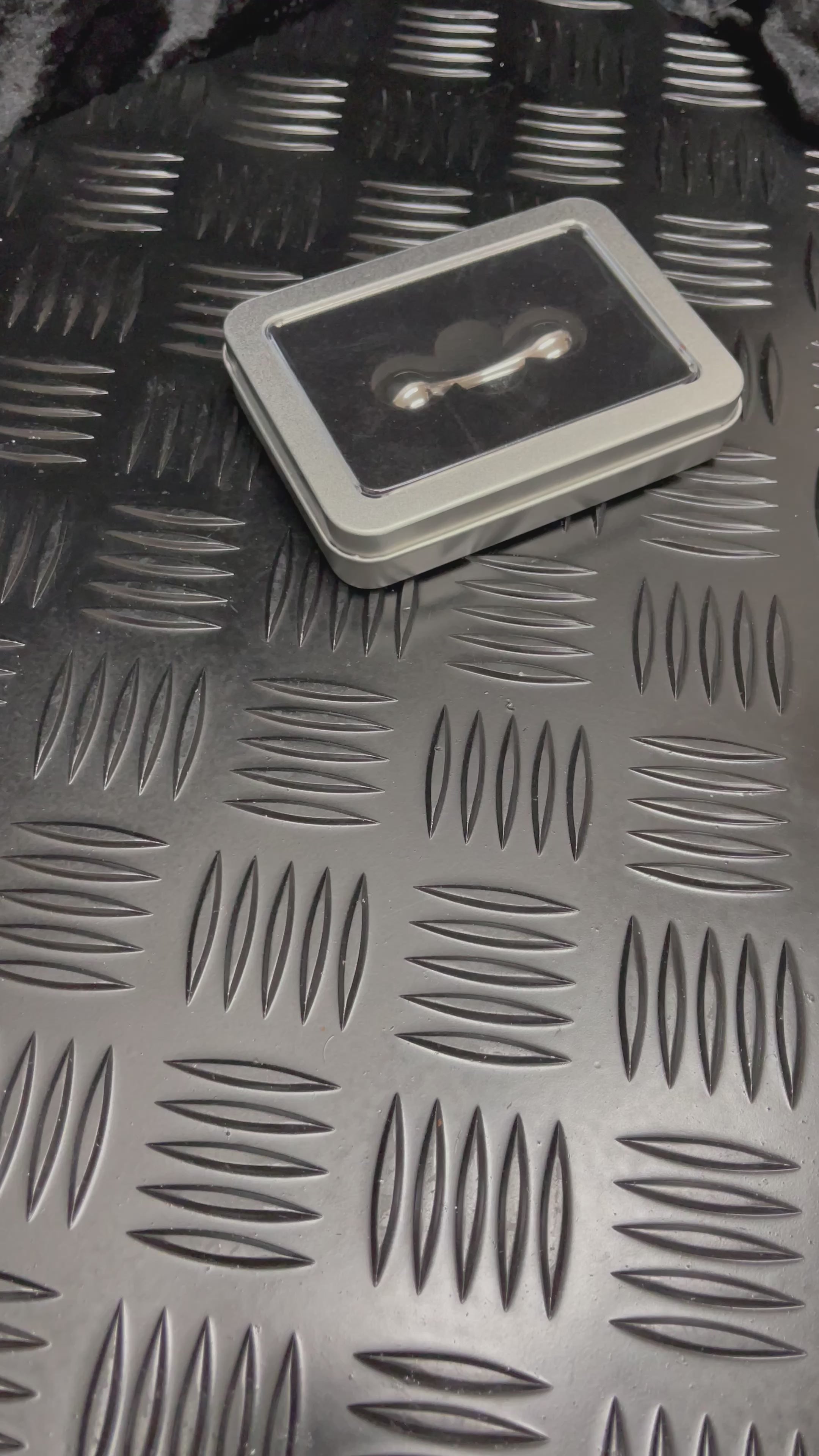 Load video: Titanium Fidget Bone by kaiko