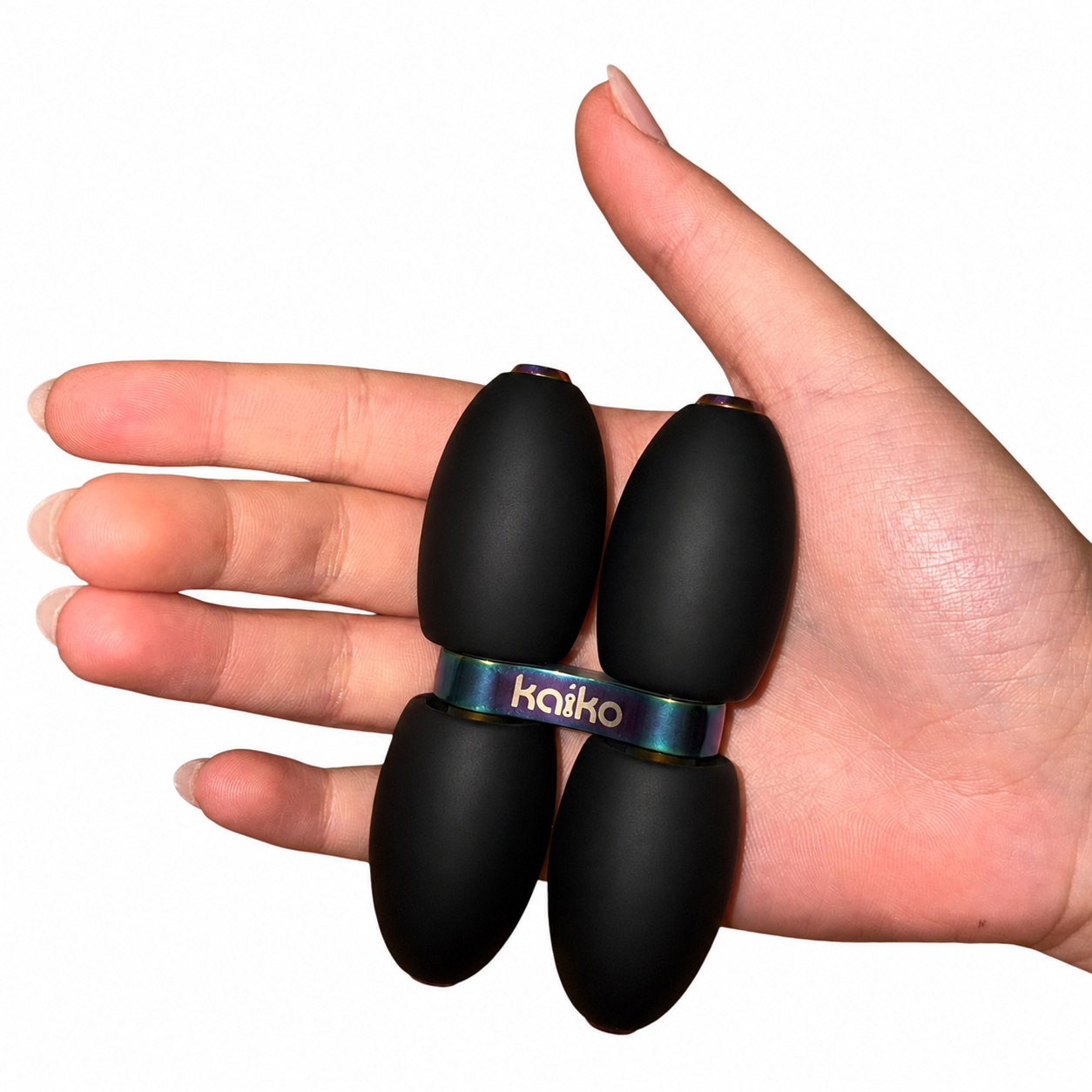 Kaiko Quad Roller resting in an open palm to show size