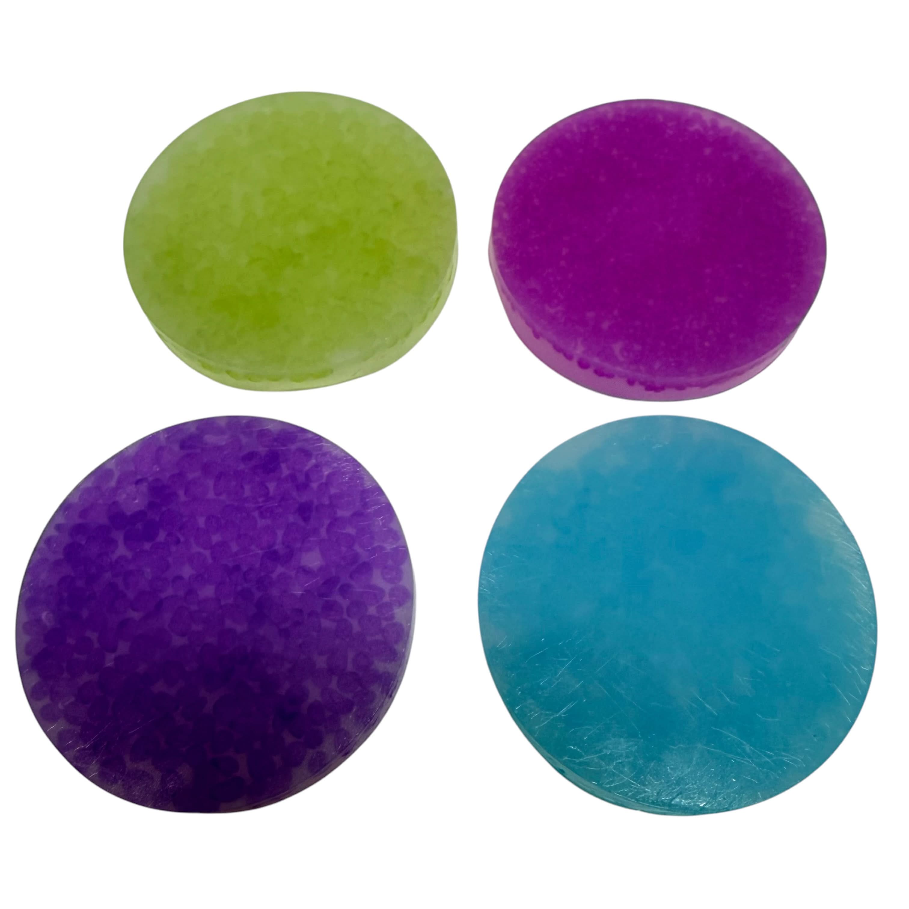 Four Vivid stretchy picking discs in purple, pink, blue and green