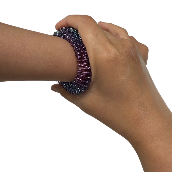 OIL SLICK Wrist Spikey - Harm Minimisation & Regulation Tool