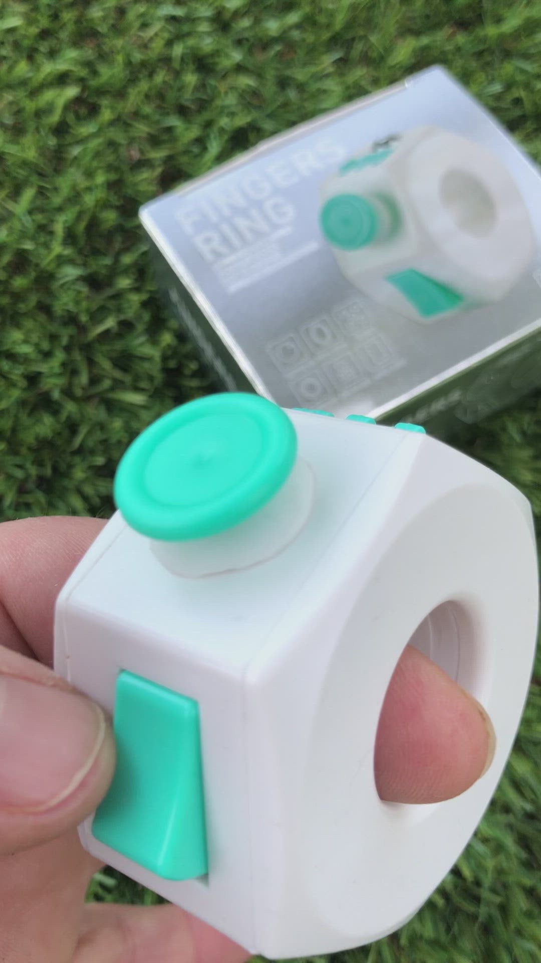 Load video: Teal and White Plastic Fidget Cube Ring