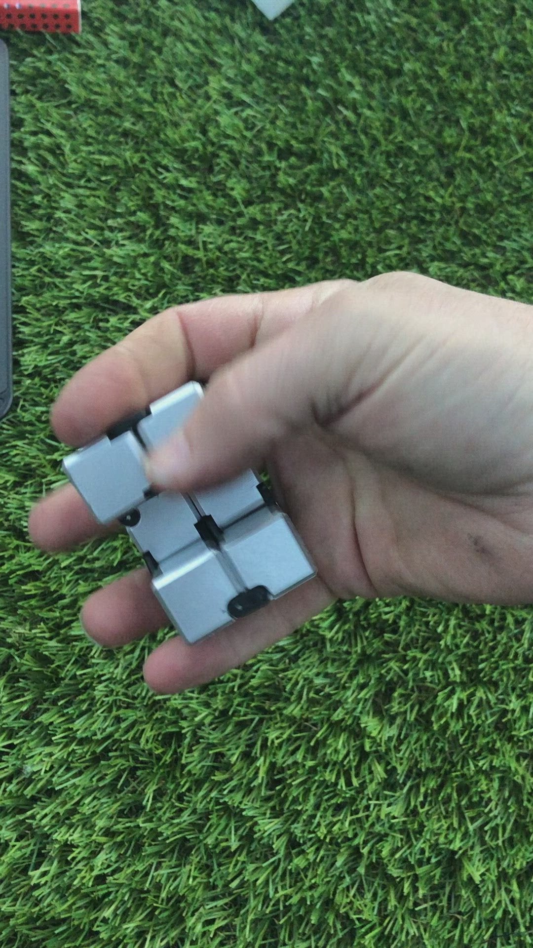 Load video: Silver Infinity Cube Fidget - 108 grams
